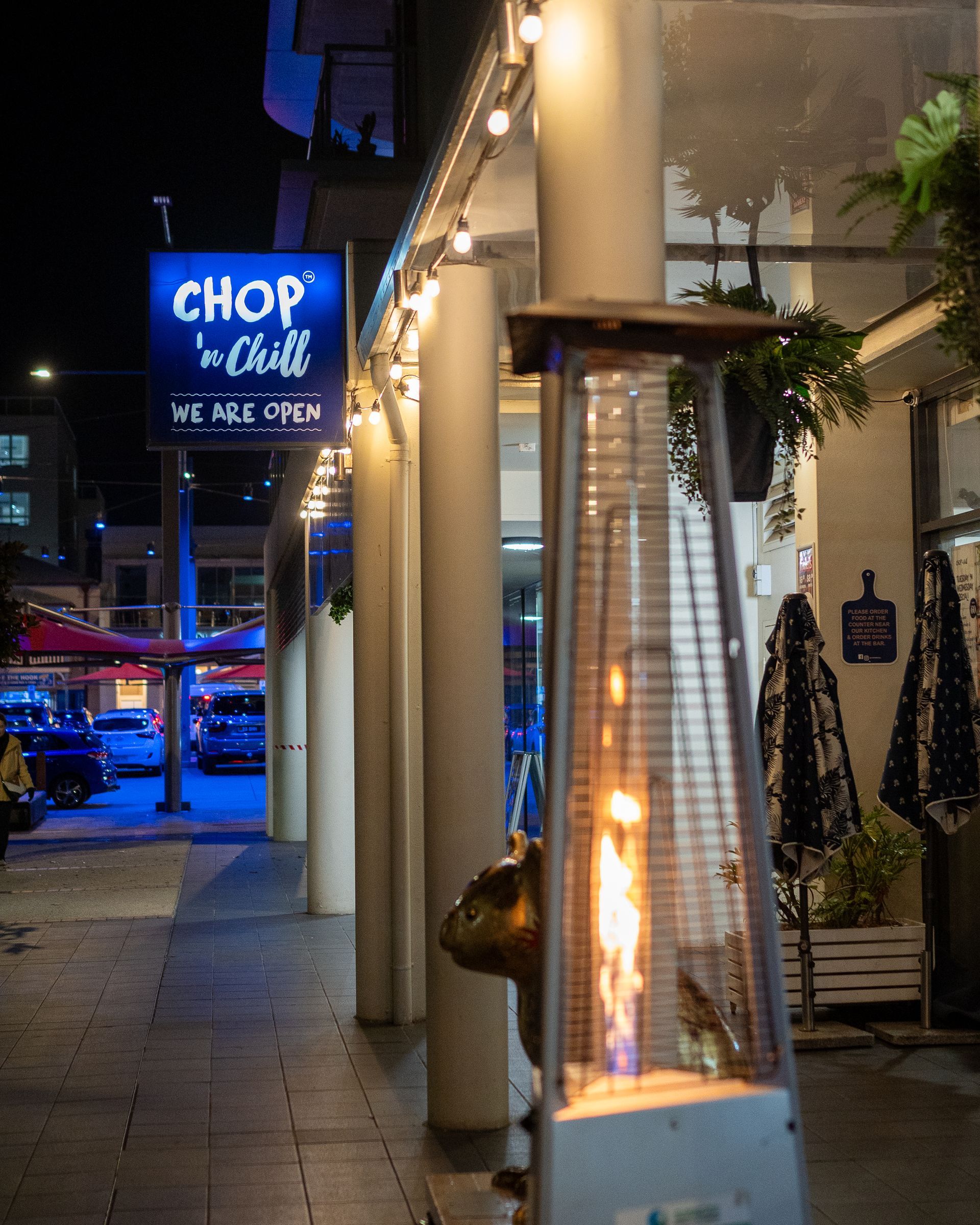 A Restaurant Called Chop N Chill Is Lit up At Night — Chop 'n Chill in Port Macquarie, NSW