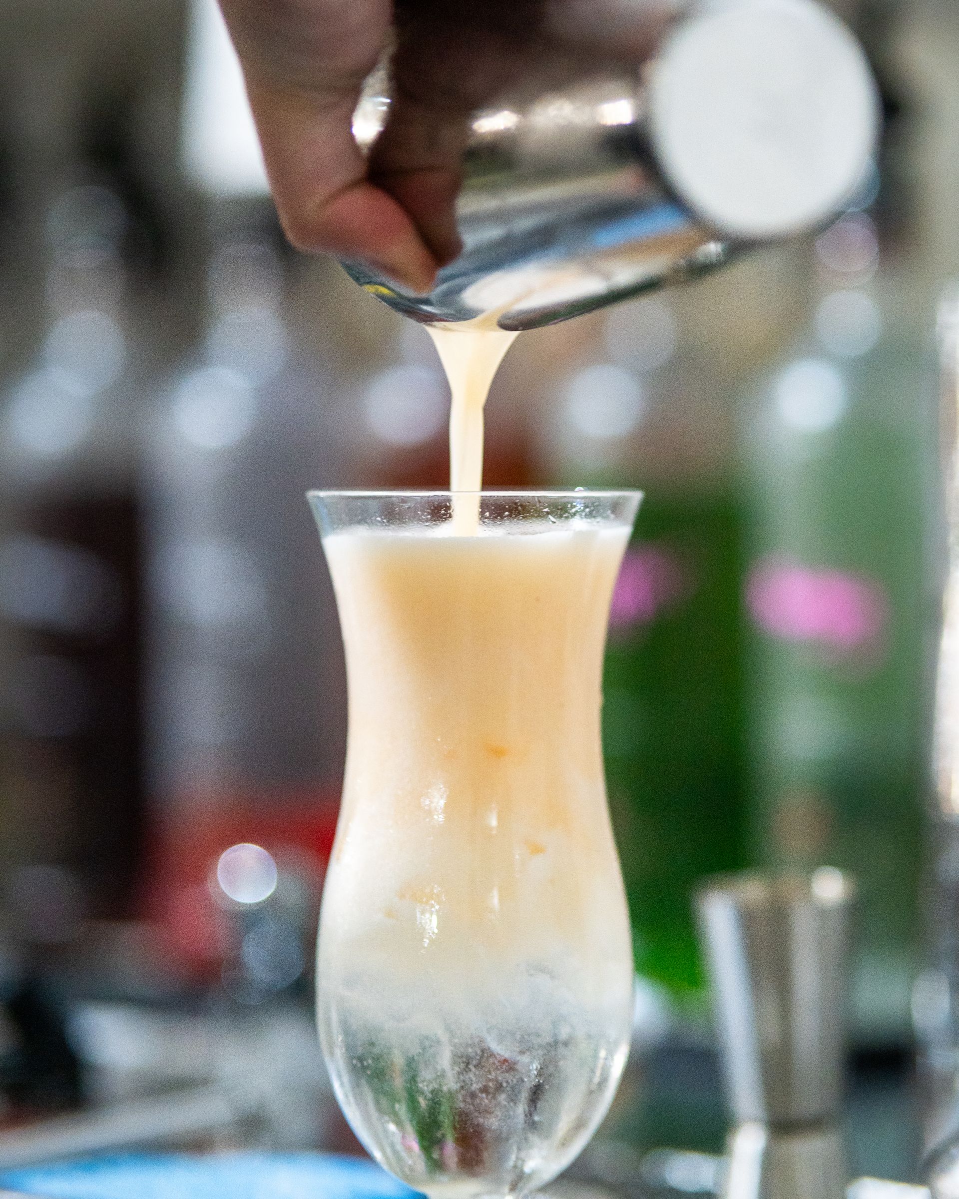 A Person Is Pouring a Drink Into a Glass — Chop 'n Chill in Port Macquarie, NSW