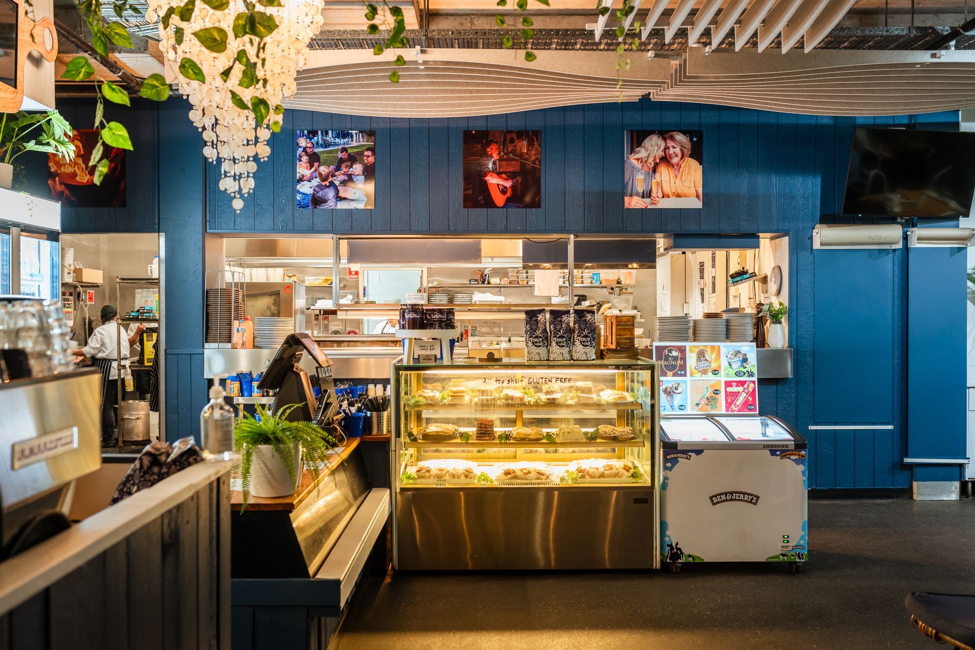 A Restaurant with Blue Walls and A Display Case Filled with Food — Chop 'n Chill in Port Macquarie, NSW