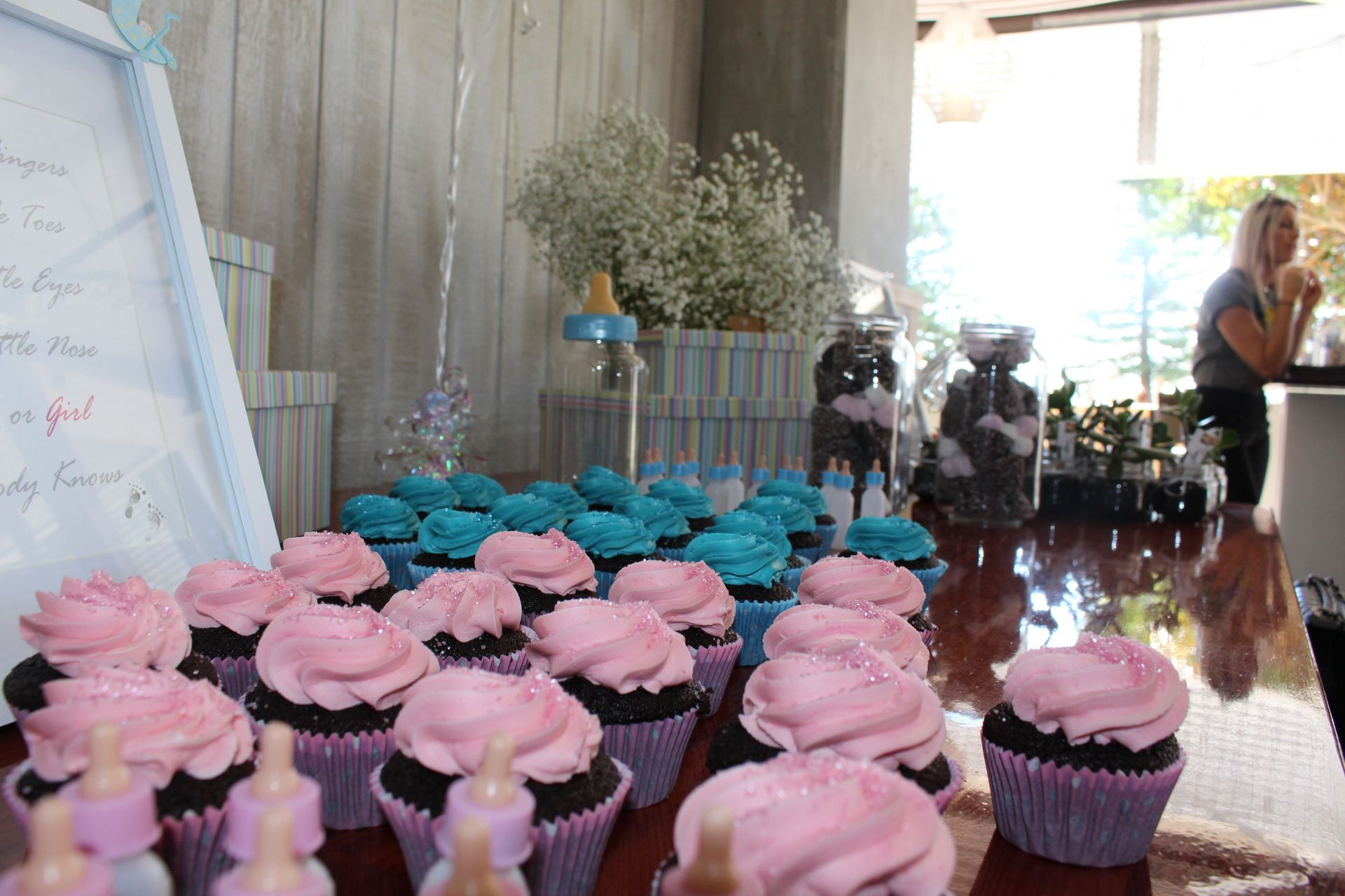 A Table Topped with Pink and Blue Cupcakes for A Baby Shower — Chop 'n Chill in Port Macquarie, NSW