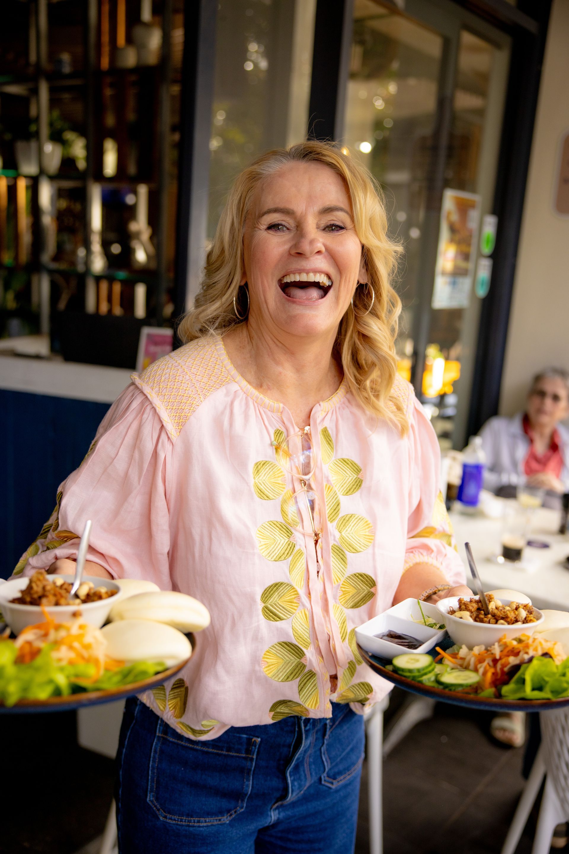 A Person Is Holding A Tray Of Food And A Bowl Of French Fries — Chop 'n Chill in Port Macquarie, NSW