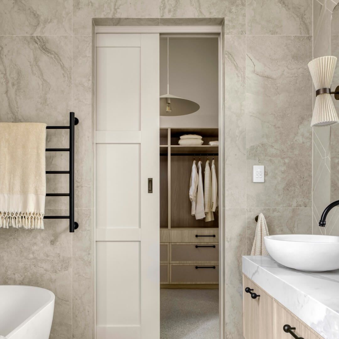 A Bathroom with A Bathtub, Sink, Mirror and Sliding Door — Bootle Timber QLD Pty Ltd in Garbutt, QLD