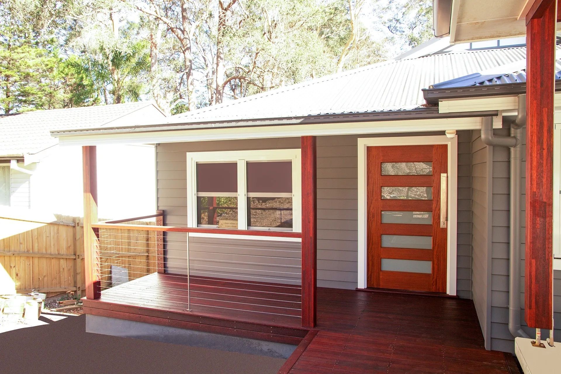 A Kitchen with A View of The Ocean Through a Sliding Glass Door — Bootle Timber QLD Pty Ltd in Garbutt, QLD