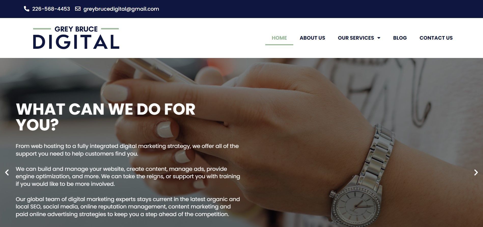 Obey Bruce Digital website homepage featuring business services and a background of someone using a smartphone.