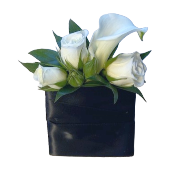 White calla lily and roses in a black square vase.