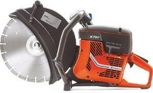 A man is using a circular saw to cut a piece of wood