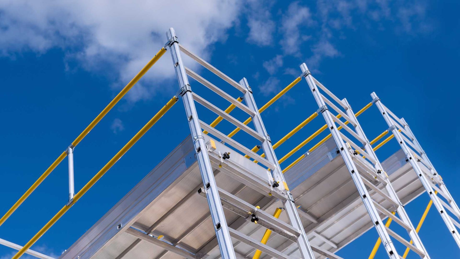 A scaffolding with a blue sky in the background