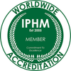 A green badge that says ' worldwide accreditation ' on it