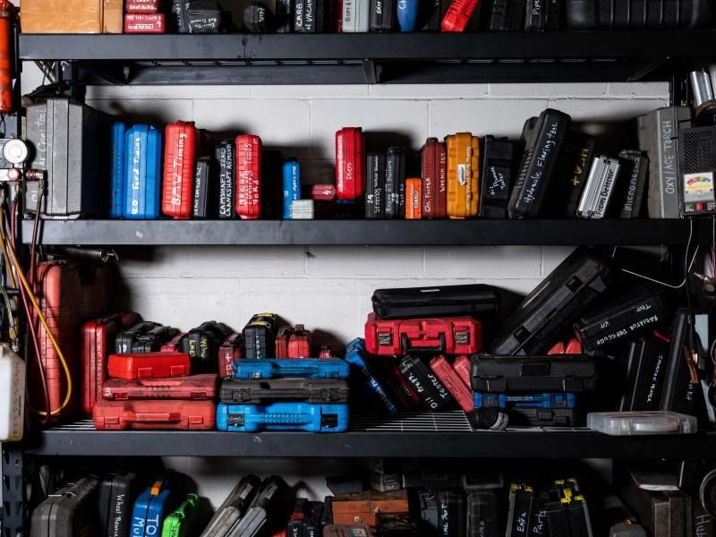 Shelves of blow mold cases with specialty automotive tools at Musser Automotive.