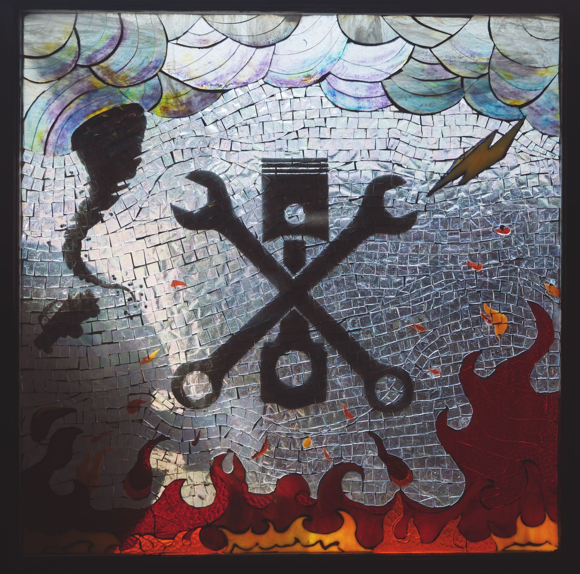 Mosaic of crossed wrenches and a piston with flames, a tornado, and lightning. | Musser Automotive