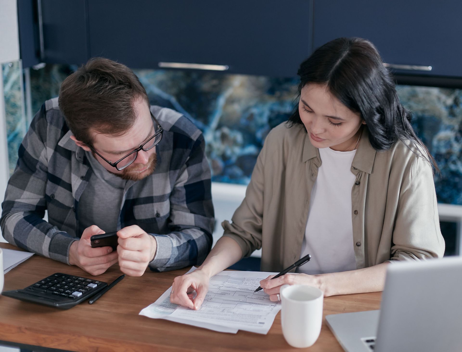 California couple comparing living trust vs will options with estate planning attorney.