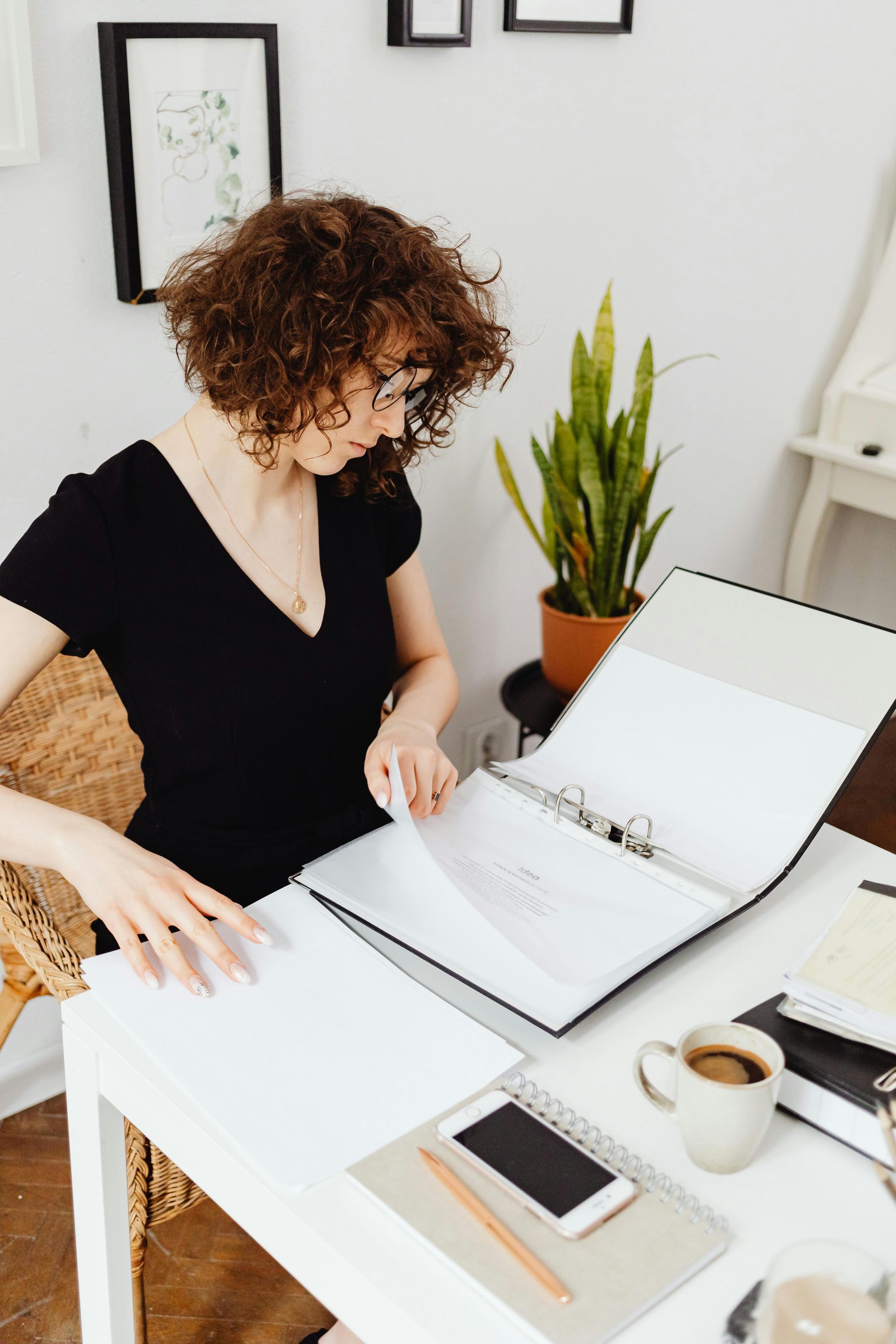 Executor going through legal forms and probate documents during estate administration