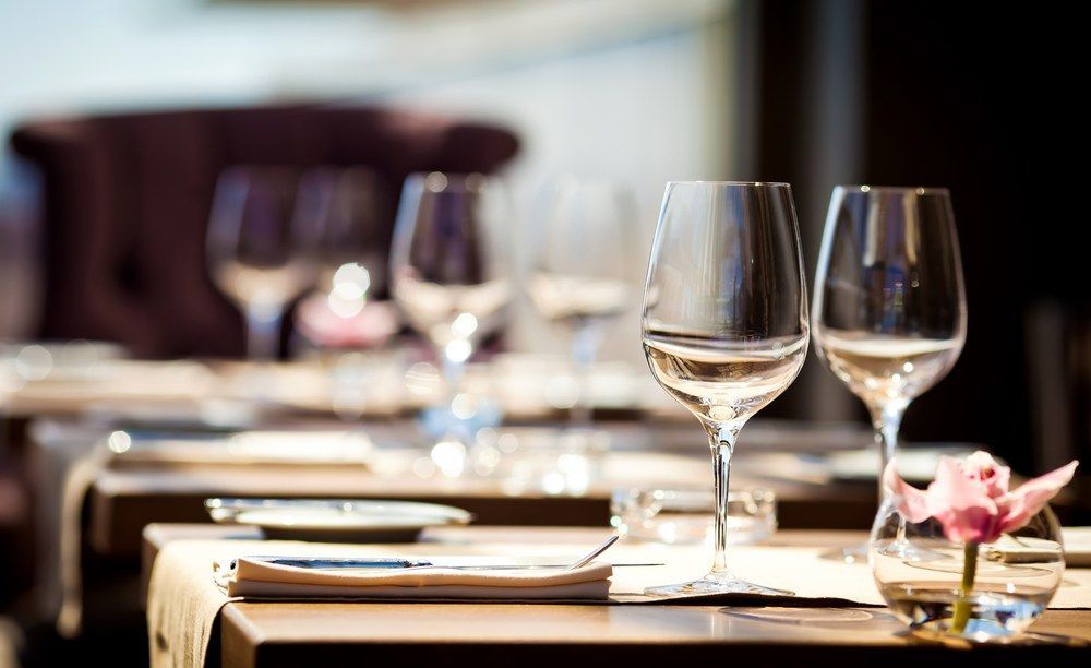 Two Wine Glasses Are Sitting on a Table in a Restaurant — Kowin Restaurant in Old Bar, NSW