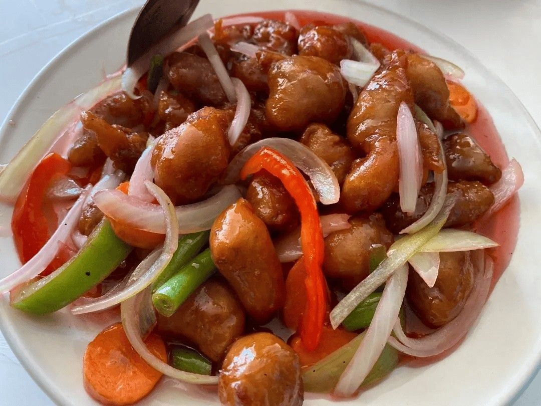 Sweet and Sour Pork with Vegetables in A White Plate — Kowin Restaurant in Taree, NSW