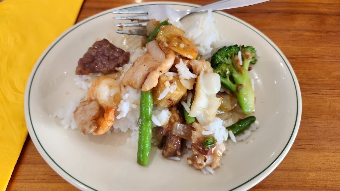 A Plate of Food With Rice and Broccoli on a Table — Kowin Restaurant in Forster, NSW
