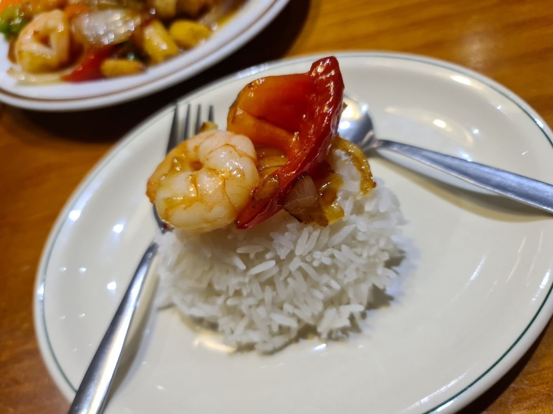 A Plate of Shrimp and Rice With a Fork and Spoon — Kowin Restaurant in Wingham, NSW