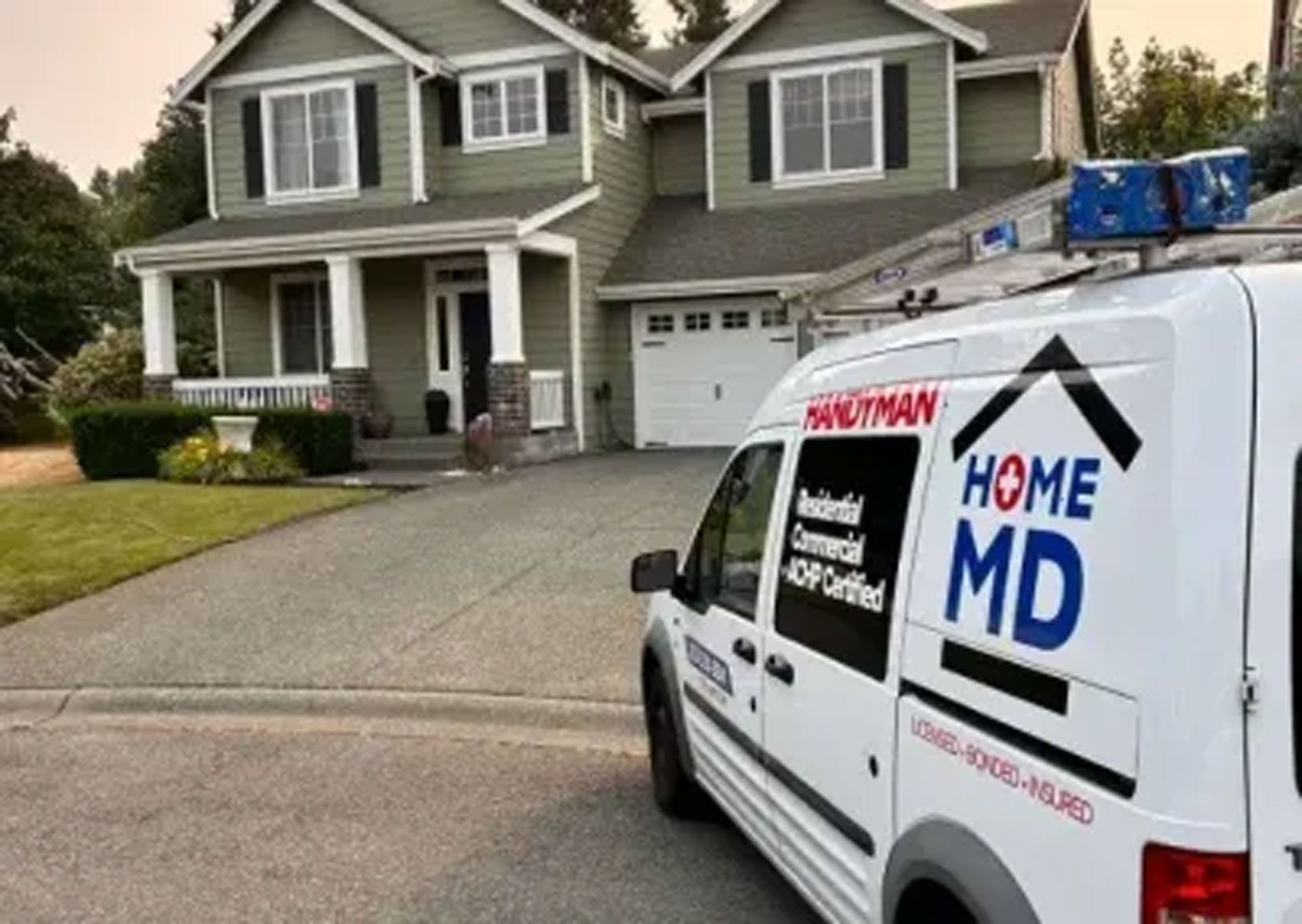 A Home MD van is parked in front of a house