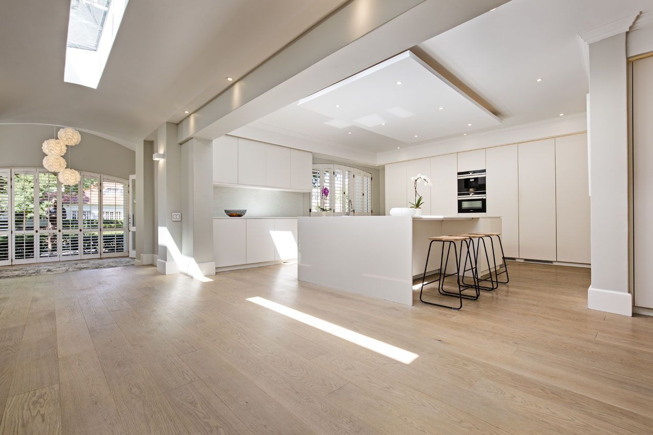A kitchen with a large island in the middle of the room.