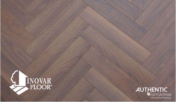 A picture of a herringbone wood floor from inovar floor