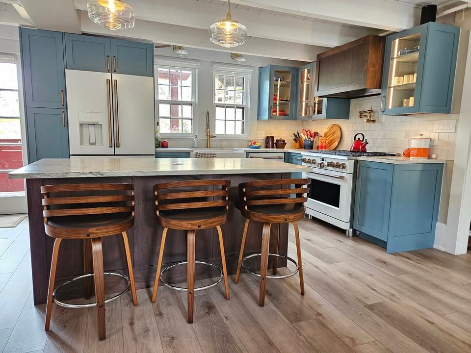 A kitchen with stainless steel appliances and wooden cabinets