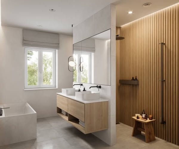 A bathroom with two sinks and a large mirror