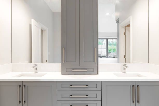 A laundry room with a washer and dryer stacked on top of each other.