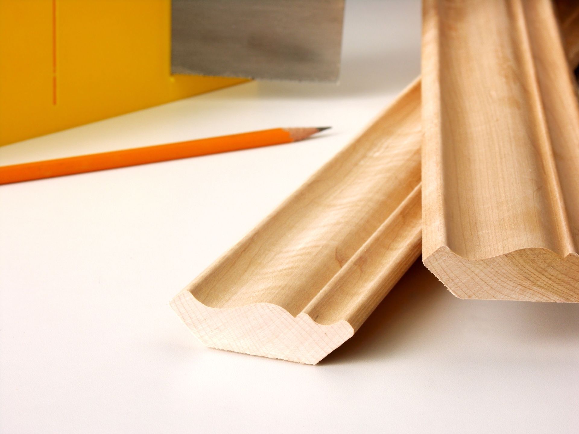 A piece of wood with a pencil next to it