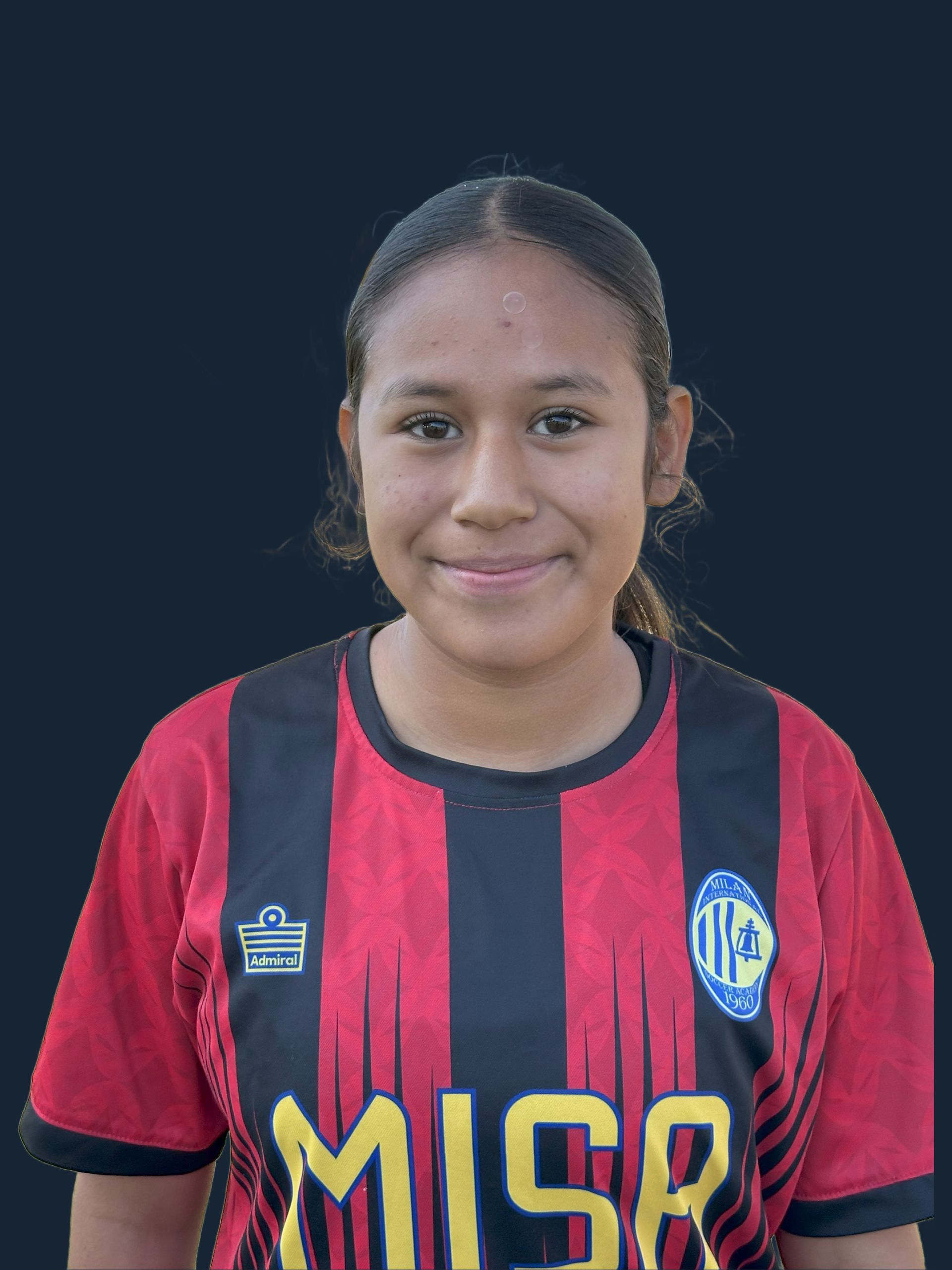 Young woman in soccer jersey, red and black stripes, smiling.