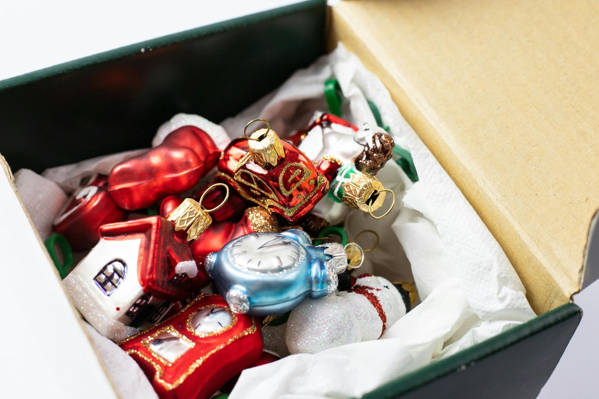 Box filled with colorful Christmas ornaments.