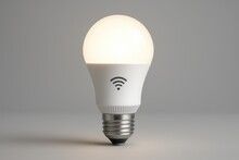 Lit, white smart LED lightbulb with a Wi-Fi symbol.