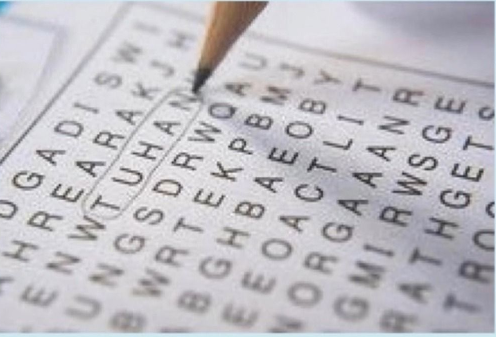 Close-up of a crossword puzzle with a pencil circling the word