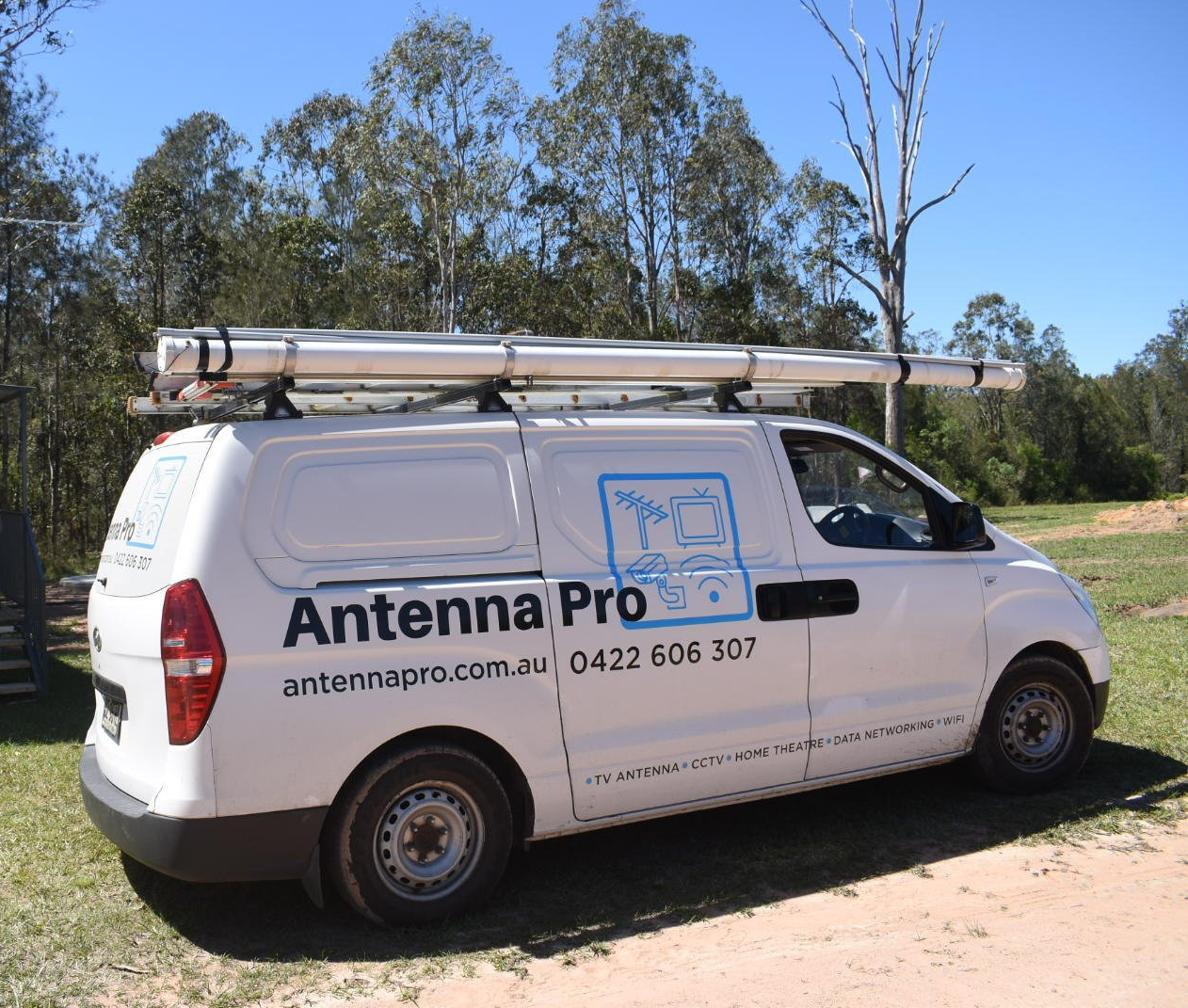 A white van with antenna pro written on the side