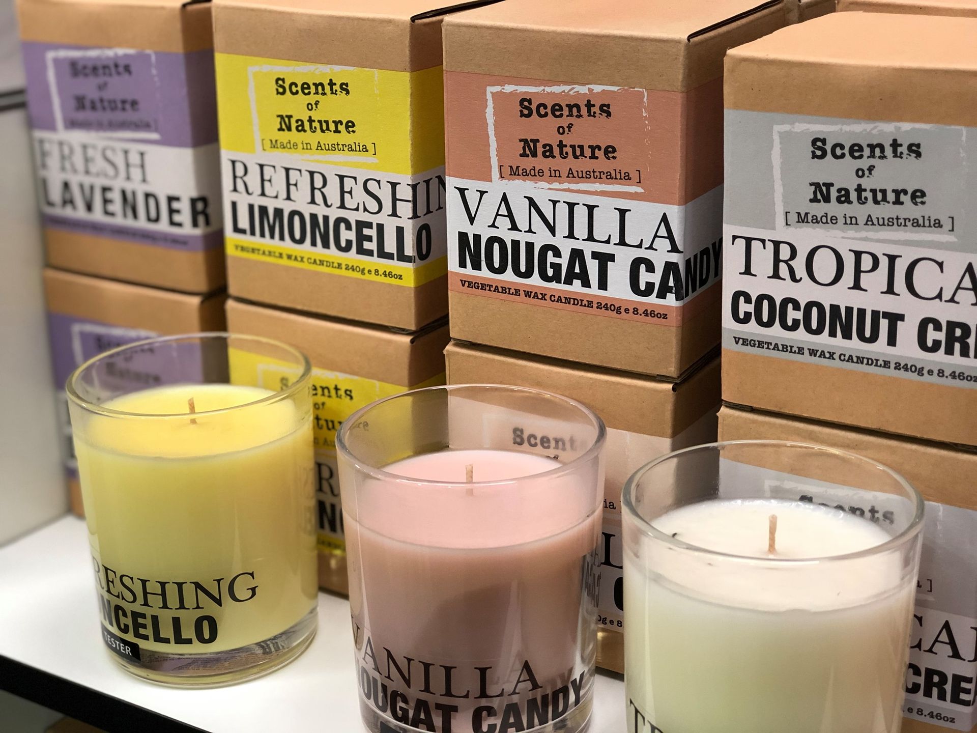 Candles in Glass Jars With Scent Names, Boxes Behind — Enterprise Electrics NT Pty Ltd in Tennant Creek, NT