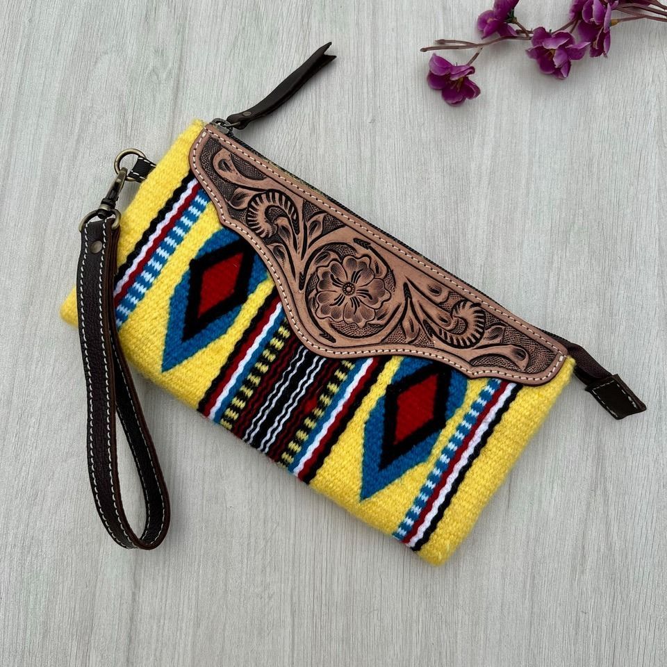Yellow Patterned Clutch With Leather Accents and a Wrist Strap — Enterprise Electrics NT Pty Ltd in Tennant Creek, NT