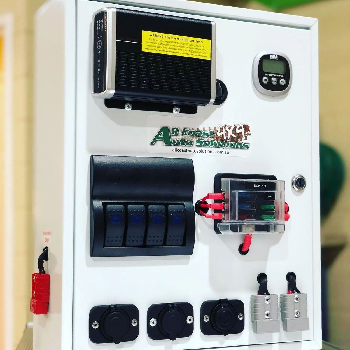 White Electrical Panel With Switches Outlets and a Display — All Coast Auto Solutions in Noosaville, QLD