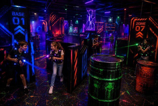 kids playing in laser tag arena