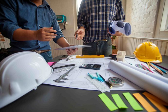 Men working on an estimate for a flooring job