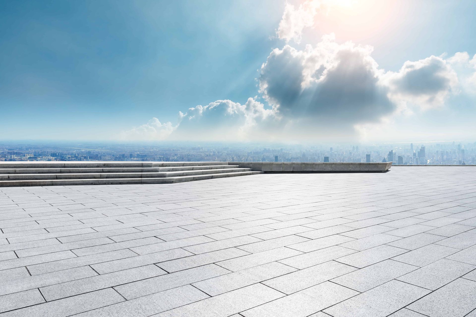 stone flooring outdoors with clouds above
