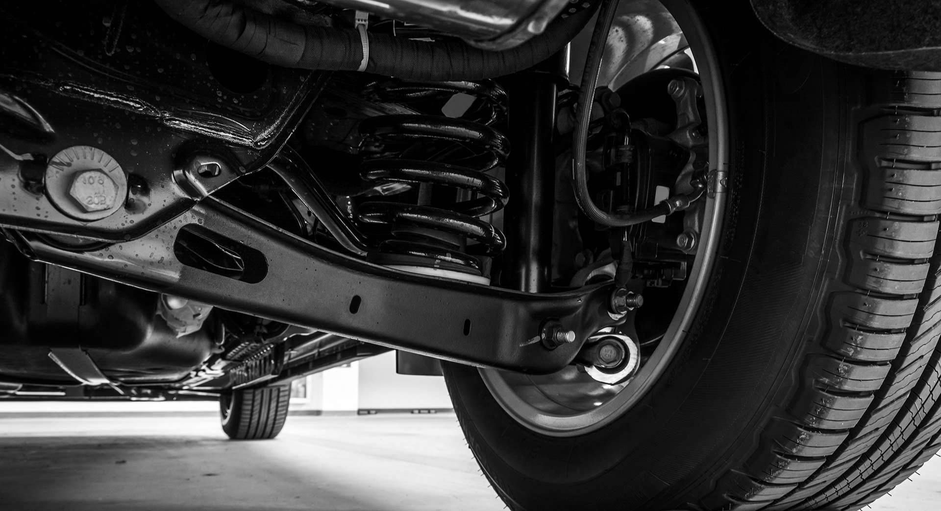 A Close Up Of The Underside Of A Car With A Tire — Advanced Auto Tech In Port Macquarie, NSW