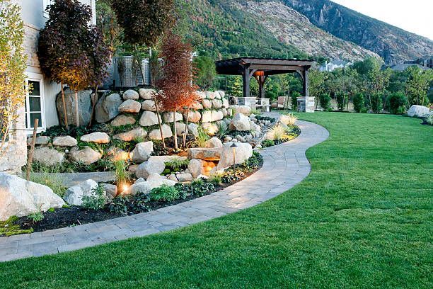 Front house curb landscape with lights installed
