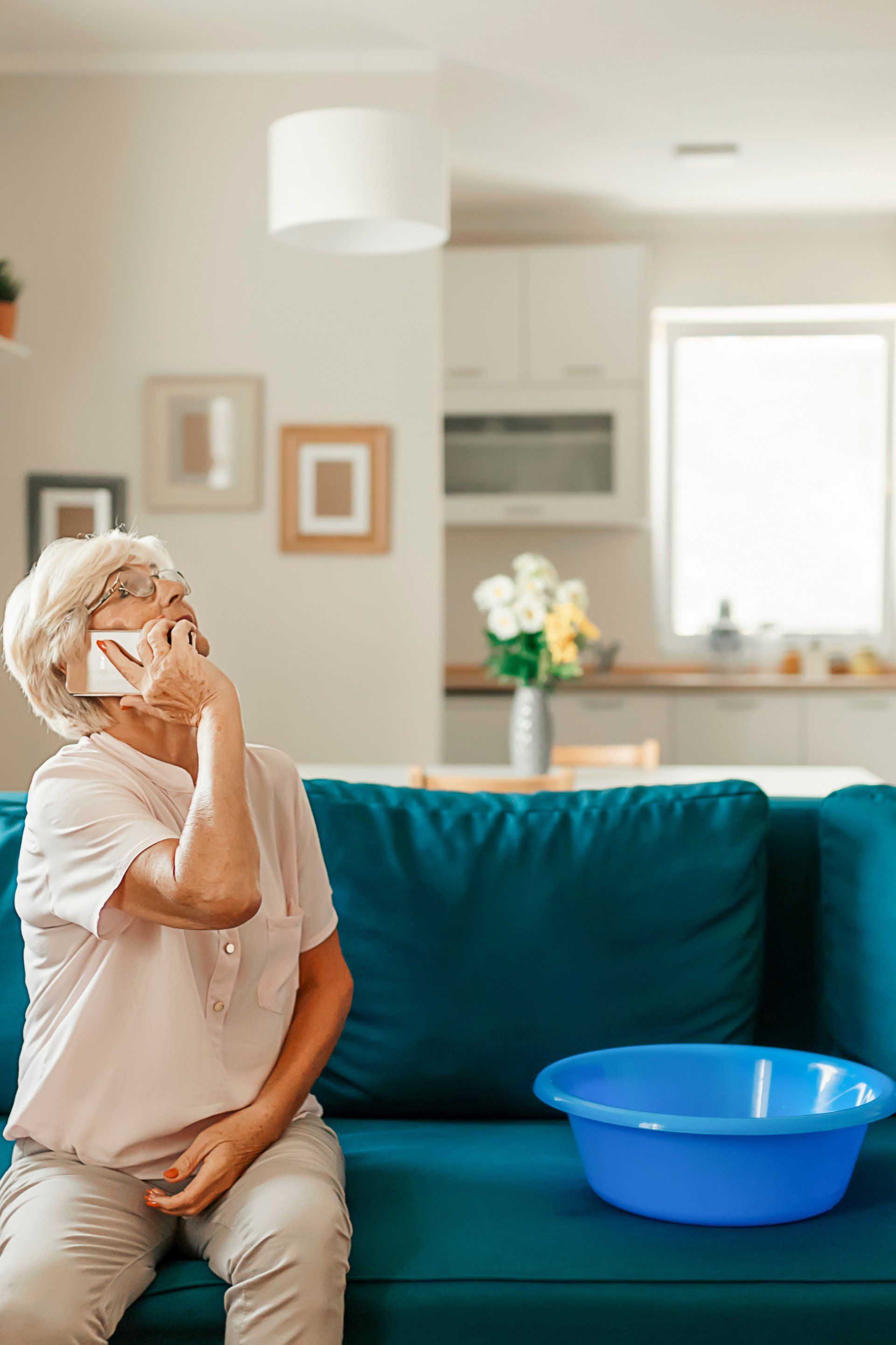 6 signs you might have a hidden water leak in your home - lady looking ceiling