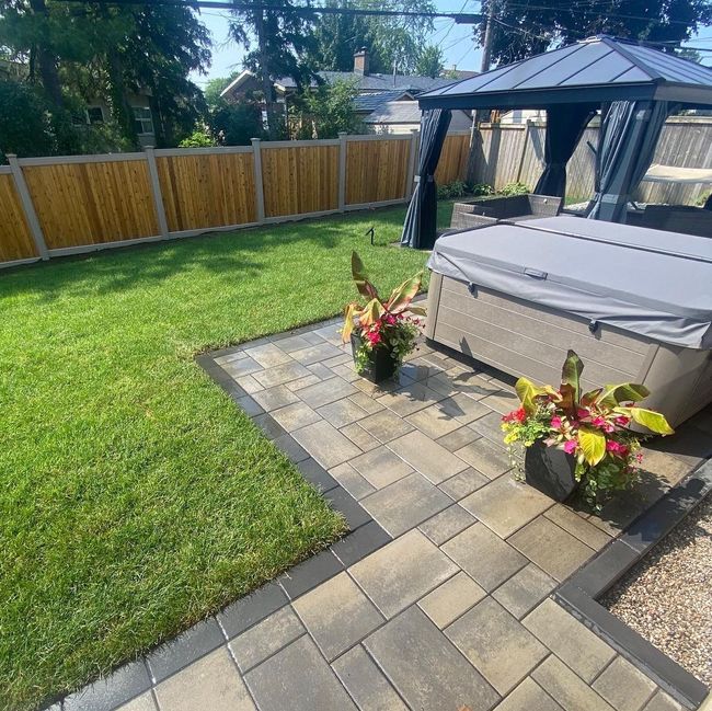 a backyard with a gazebo and a hot tub