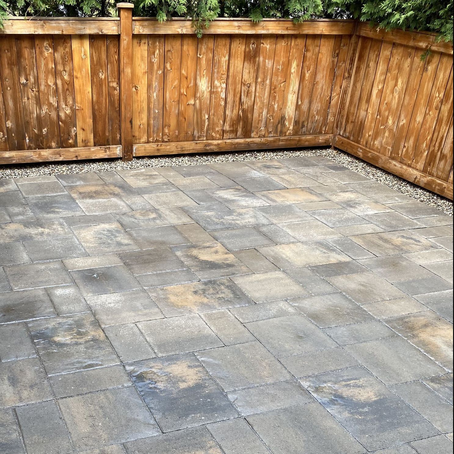 patio area surrounded by wooden fence