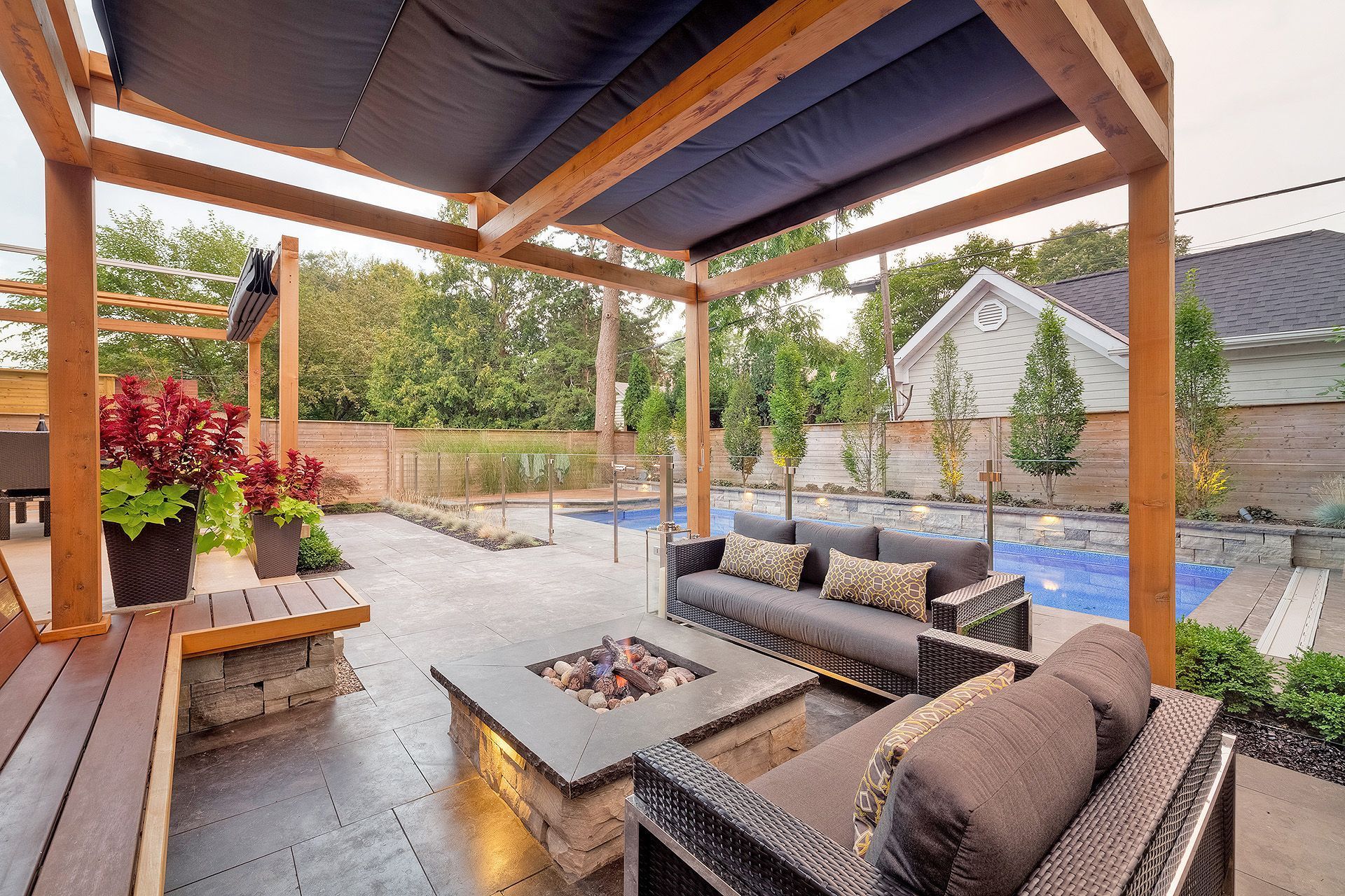 a fire pit in the middle of the patio area