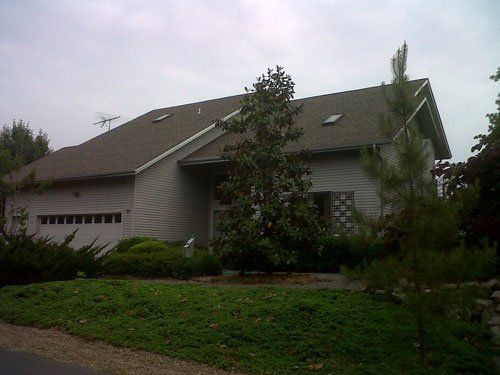 A house with a roof that has a skylight on it