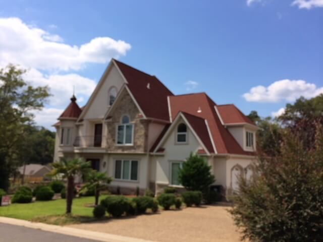 A large white house with a red roof