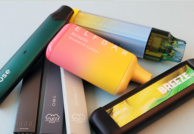 A bunch of electronic cigarettes are stacked on top of each other