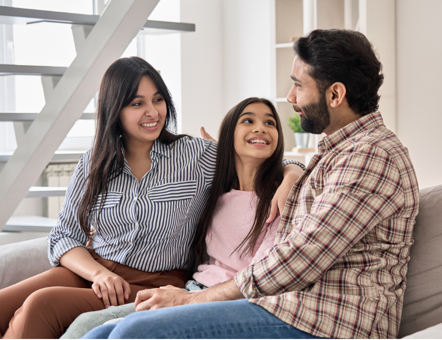A family talking on a couch