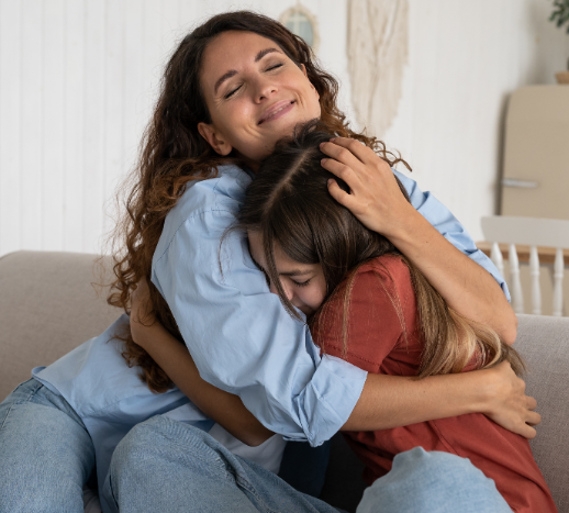 A mother and daughter hugging