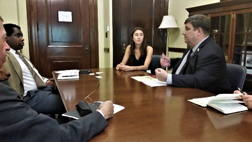 Image of CEO Steve addressing group at table